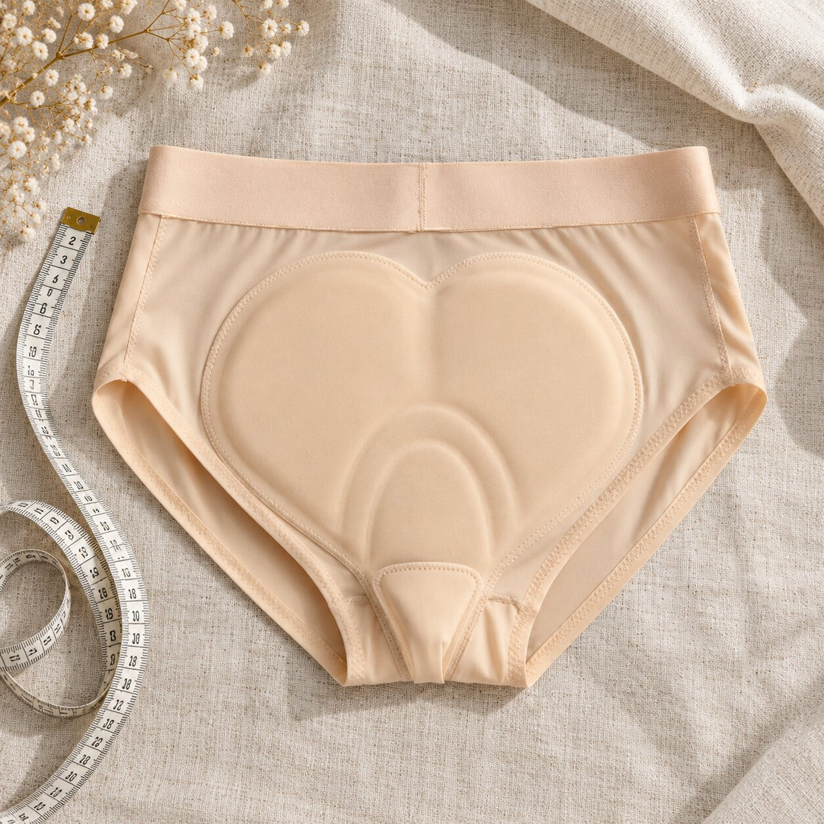 Riderie padded riding underwear turned inside out, showing the pad wide at the back and narrow in front