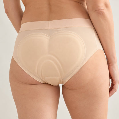 Back view of a woman wearing Riderie padded riding underwear in Nude