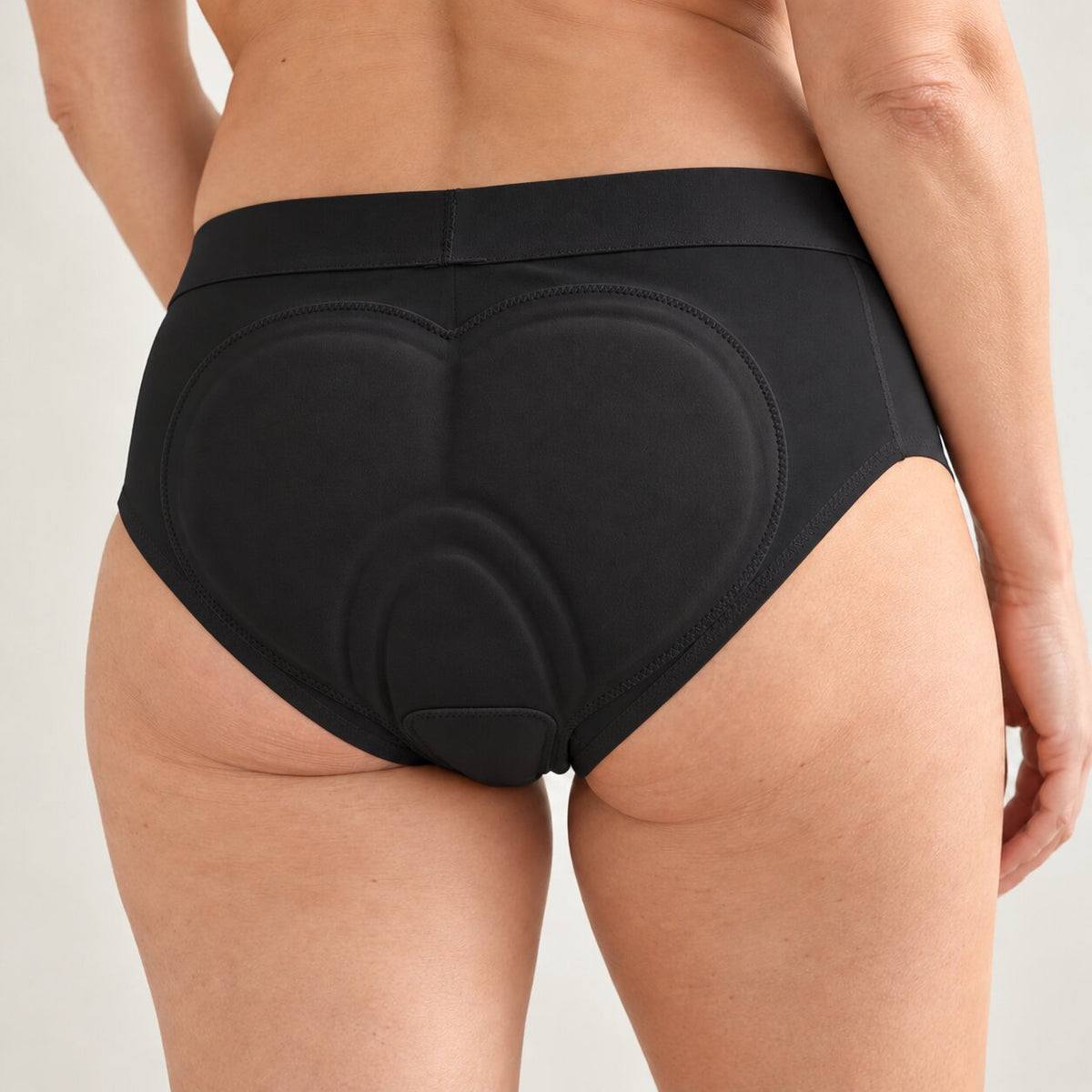 Back view of a woman wearing Riderie padded riding underwear in Black